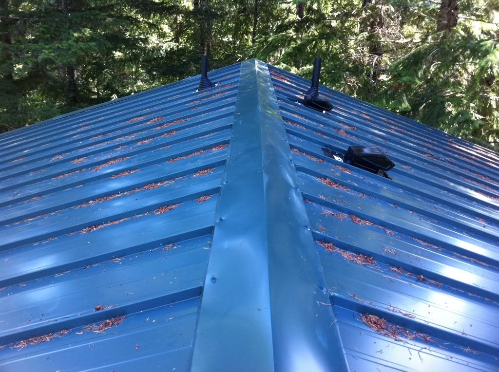Flashing vents in metal roof